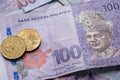 Close up of Ringgit Malaysia 100 with 50 cents, Malaysian currency Royalty Free Stock Photo
