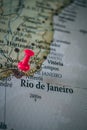 Close up of Rio de Janeiro pin pointed on the world map with a pink pushpin Royalty Free Stock Photo