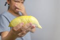 Close-up of 1 ripe durian. Ready to eat., The foul smell of durian makes this woman dislike eating durian, This woman doesn`t lik