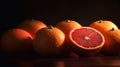 Close-up of ripe grapefruit against a dark background. AI-generated.