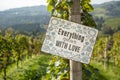 Close up of ripe red grapes with inscription - Everything grows with love, ready for autumn harvest in south Styria Royalty Free Stock Photo