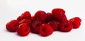 Close up of ripe red raspberries on white surface, no people Royalty Free Stock Photo