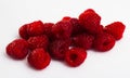 Close up of ripe red raspberries on white surface, no people Royalty Free Stock Photo