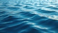 Close-up of rippled ocean surface in deep blue tones. Dynamic water texture reveals subtle light reflections. Evokes tranquility Royalty Free Stock Photo