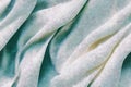 Close-up of rippled white natural fur silk fabric texture background. Suede leather chamois delicate fabric textile