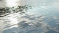 Close up of ripples on the surface of the river with clouds reflection in the water. Stock. Flow of dark water in calm Royalty Free Stock Photo