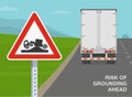 Close-up of risk of grounding ahead sign. Back view of a heavy goods vehicle on road.