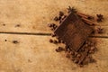 Close-up of roasted arabica coffee beans, dark chocolate bar