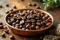 Close-up of roasted coffee beans in a copper dish on wooden surface Royalty Free Stock Photo