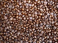Close up of Roasted coffee beans isolated background, ready to give freshness and alongside the businessman Royalty Free Stock Photo
