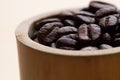 Close-up roasted coffee beans, seeds on wooden background with copy space using for drink menu ingredient, espresso, cappucino, Royalty Free Stock Photo