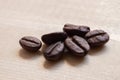 Close-up roasted coffee beans, seeds on wooden background with copy space using for drink menu ingredient, espresso, cappucino, Royalty Free Stock Photo