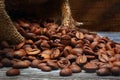 Close-up of roasted coffee beans spilled from burlap sack Royalty Free Stock Photo