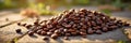 Close-up of roasted coffee beans on stone surface with sunlight Royalty Free Stock Photo
