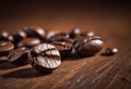 Close-up of roasted coffee beans on a wooden surface