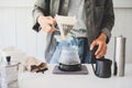 Close up. roasted coffee on coffee percolator with professional of a barista making coffee for dripping hot coffee into the cup Royalty Free Stock Photo