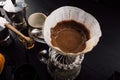 Close up. roasted coffee on coffee percolator with professional of a barista making coffee for dripping hot coffee into the cup Royalty Free Stock Photo