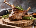 Close-up of roasted lamb meat, dish on a board