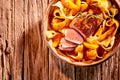 Close up of roasted pasta and sliced duck breast