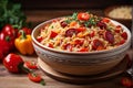 Close-up of Roasted pepper and chorizo orzo salad includes red peppers, red onion, chorizo, cherry tomatoes, and orzo pasta