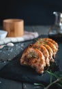 Close-up of roasted pork chops with fresh rosemary on dark background Royalty Free Stock Photo