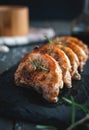 Close-up of roasted pork chops with fresh rosemary on dark background Royalty Free Stock Photo