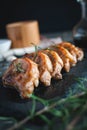 Close-up of roasted pork chops with fresh rosemary on dark background Royalty Free Stock Photo