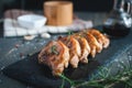 Close-up of roasted pork chops with fresh rosemary on dark background Royalty Free Stock Photo