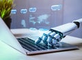 Close up on robot hand working on laptop to checking correct data by using RPA function softwere. Generative AI Royalty Free Stock Photo