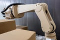 close-up of robotic arm, handling and palletizing boxes Royalty Free Stock Photo
