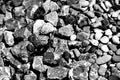 Close-up in the rock garden with round river pebbles and sharp-edged gravel in black and white Royalty Free Stock Photo