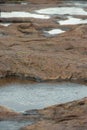 Rock pool with ripples from rain Royalty Free Stock Photo