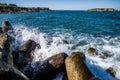 Close up of rocks and waves crashing on them. Water splashing on the rocks Royalty Free Stock Photo