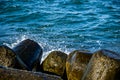 Close up of rocks and waves crashing on them. Water splashing on the rocks Royalty Free Stock Photo