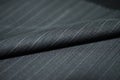 Close up roll black blue shade fabric of suit