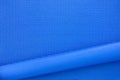 Close up roll blue color yoga mat texture background, top view, copy space, healthy lifestyle, sport and exercise concept Royalty Free Stock Photo