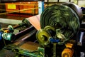 Close up of a roll of rubber on a machine in a conveyor belt factory