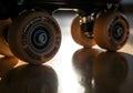 Close-Up Roller Skate Wheels on Glossy Wood Floor Royalty Free Stock Photo