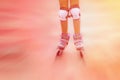 Close up of roller skater girl in motion. Toned image Royalty Free Stock Photo