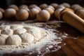 close-up of rolling pin flattening dough balls