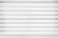 Rolling steel door texture or roller shutter door , white grey  background Royalty Free Stock Photo