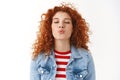 Close-up romantic cute feminine silly redhead girl curly hairstyle prepared lips kiss folding mouth close eyes wanna