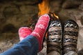 Close up of romantic legs in socks in front of fireplace Royalty Free Stock Photo