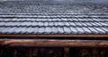 Close-up, the roof of a house made of wooden tiles. Royalty Free Stock Photo