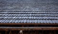 Close-up, the roof of a house made of wooden tiles. Royalty Free Stock Photo