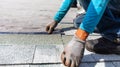 Roofer installing roof shingles