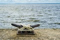 Boat anchoring on a public quay on a cloudy day