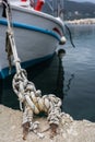 Close up of a rope holding moored boat Royalty Free Stock Photo