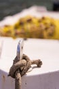 Close up of a rope knot holding moored boat Royalty Free Stock Photo