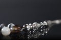 Close-up of rosary beads on a dark background